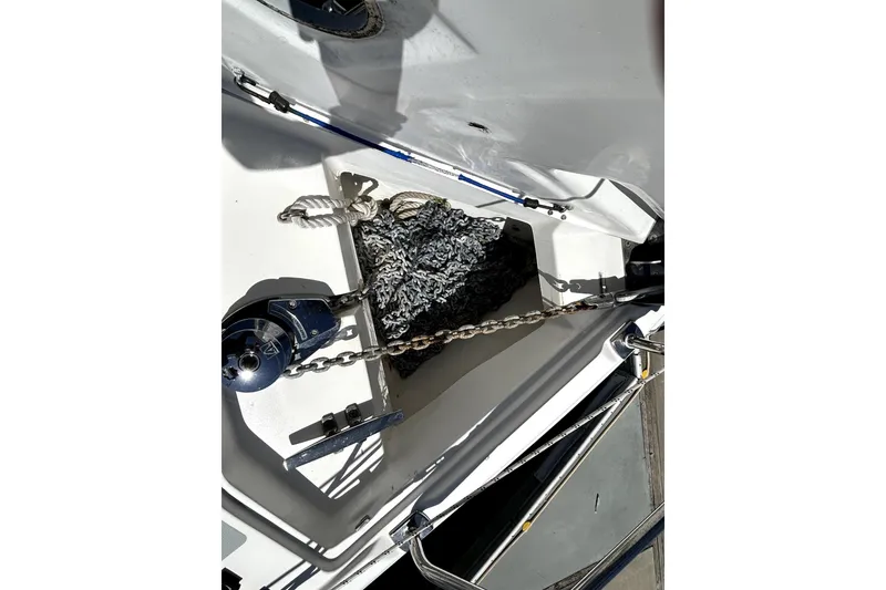 Slide: The Image of 2007 Hunter 41 Deck Salon sailboat docked at marina under clear blue sky. - 37