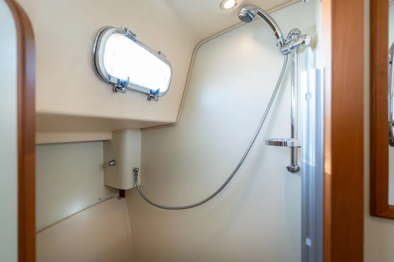 Slide: The Image of Shower area in 2008 Island Packet 465 yacht with window and chrome fixtures. - 20