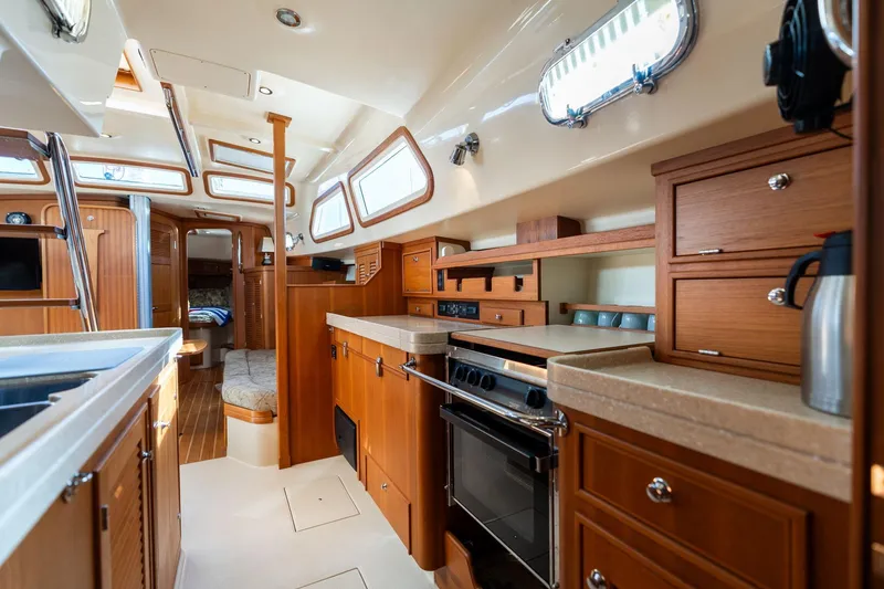 Slide: The Image of Luxurious interior of 2008 Island Packet 465 yacht with modern kitchen and cozy seating. - 22