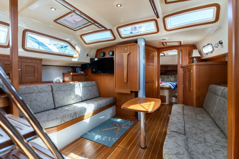 Slide: The Image of Luxurious 2008 Island Packet 465 yacht interior with elegant wood finish and comfortable seating. - 23