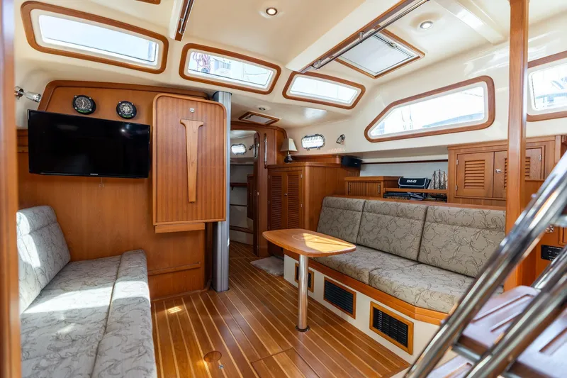Slide: The Image of Luxurious interior of 2008 Island Packet 465 yacht with elegant wood finish and comfortable seating. - 33