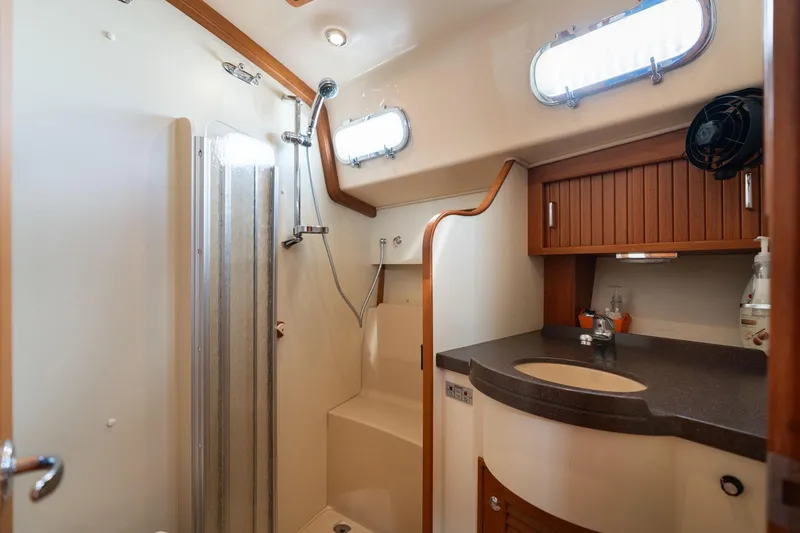 Slide: The Image of Luxurious bathroom in 2008 Island Packet 465 yacht with shower and wooden cabinetry. - 37