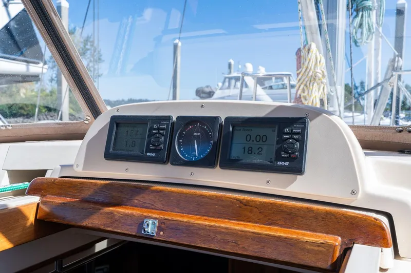 Slide: The Image of Cockpit dashboard of 2008 Island Packet 465 sailboat with navigation instruments. - 45