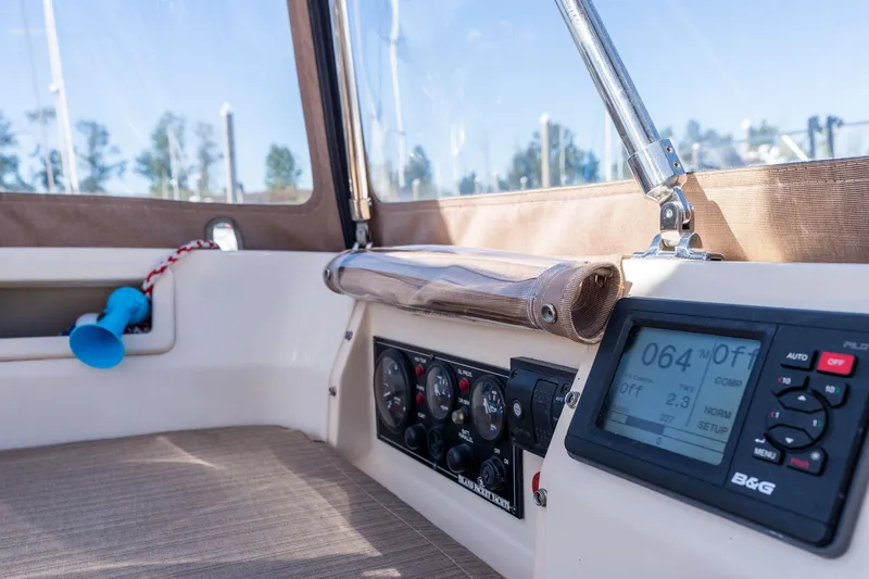 Slide: The Image of Interior view of 2008 Island Packet 465 sailboat cockpit with navigation instruments. - 47