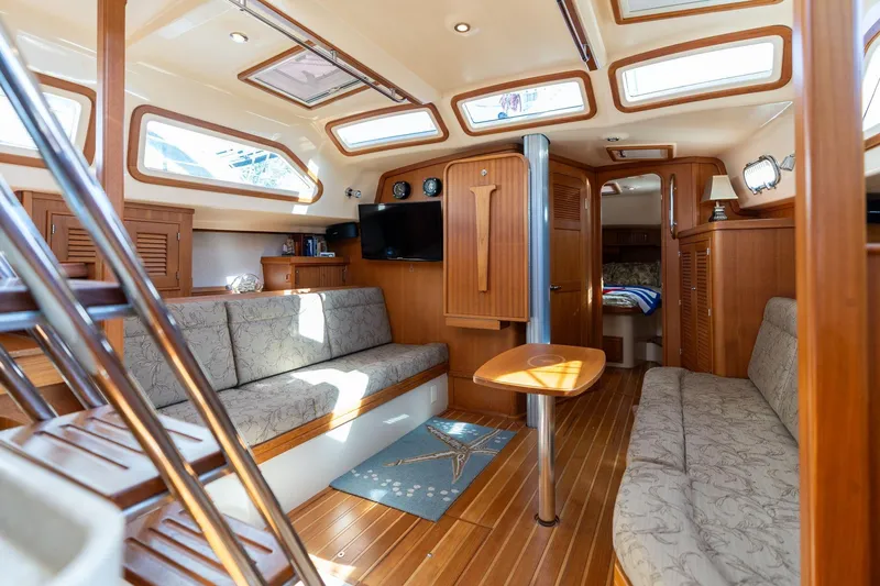 Slide: The Image of Luxurious interior of 2008 Island Packet 465 yacht with elegant wood finish and comfortable seating. - 5