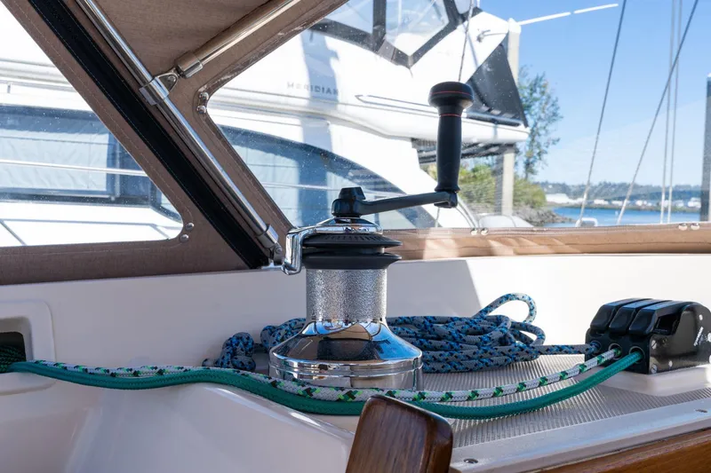 Slide: The Image of Sailboat winch and ropes on 2008 Island Packet 465, docked with scenic background. - 53