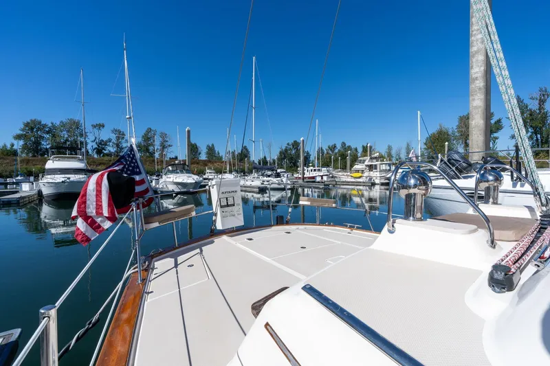 Slide: The Image of 2008 Island Packet 465 yacht docked in a marina with clear blue skies. - 54