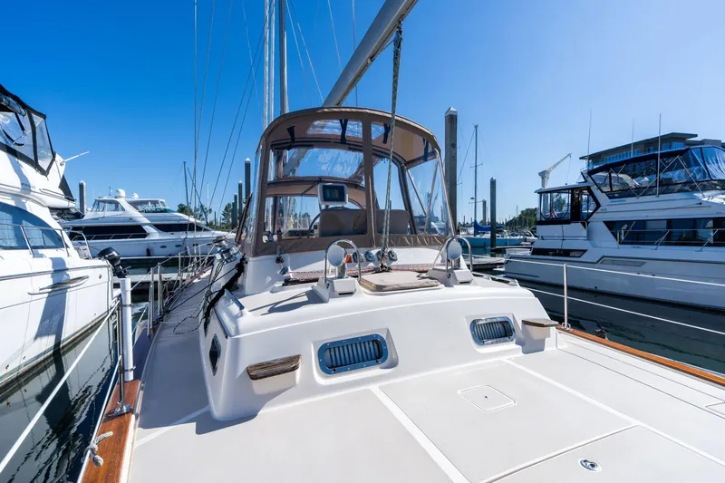 Slide: The Image of 2008 Island Packet 465 yacht docked at marina under clear blue sky. - 57
