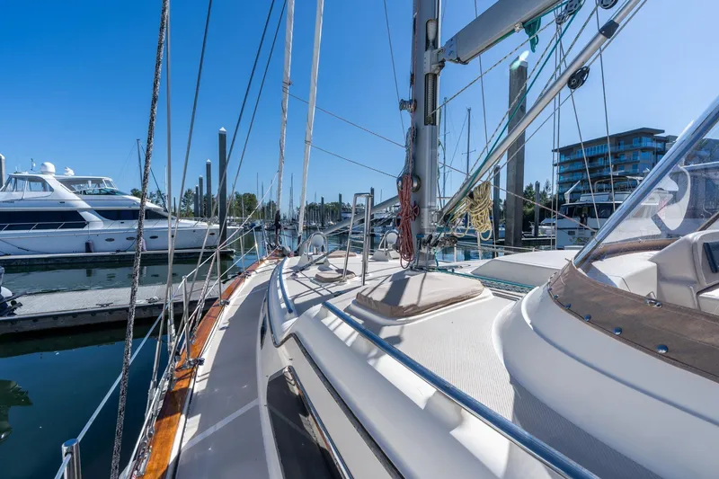 Slide: The Image of 2008 Island Packet 465 sailboat docked in marina under clear blue sky. - 59