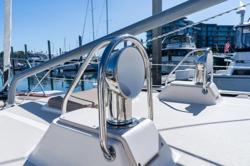 Slide: The Image of 2008 Island Packet 465 yacht deck with polished metal fittings in marina. - 62
