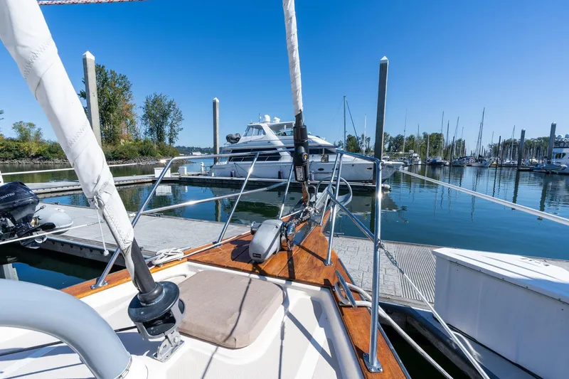 Slide: The Image of Sailboat Island Packet 465, 2008 model, docked in a serene marina setting. - 65