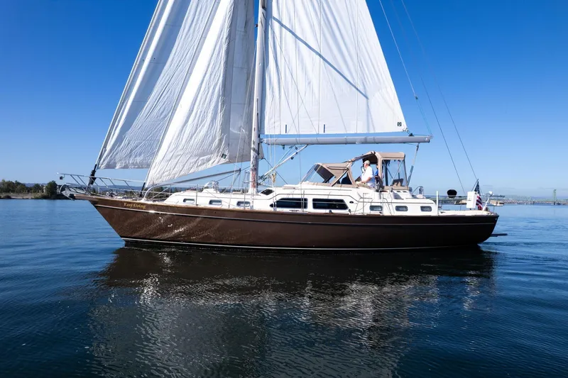 Slide: The Image of Sailing yacht Island Packet 465, 2008 model, cruising on calm waters under clear blue skies. - 72