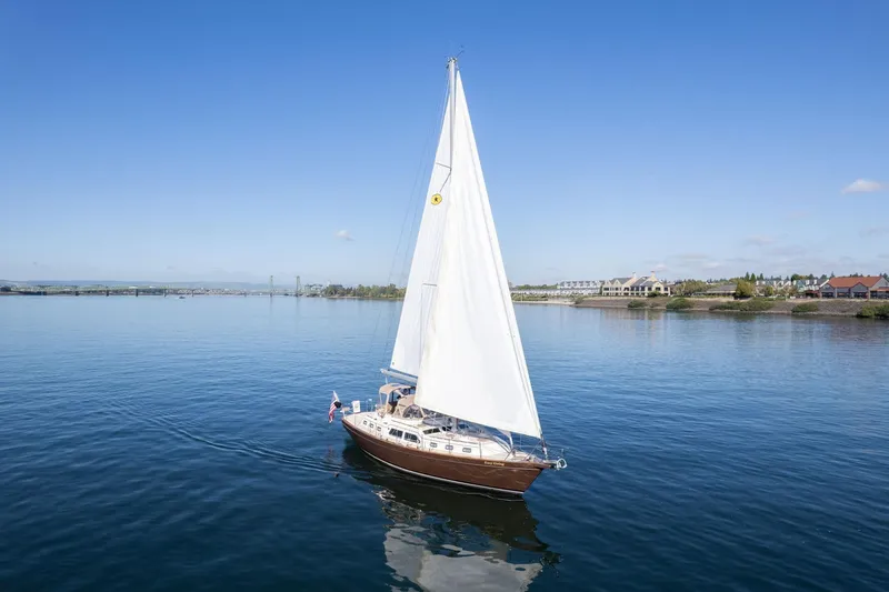 Slide: The Image of Sailing yacht Island Packet 465, 2008 model, cruising on calm waters under clear blue skies. - 76