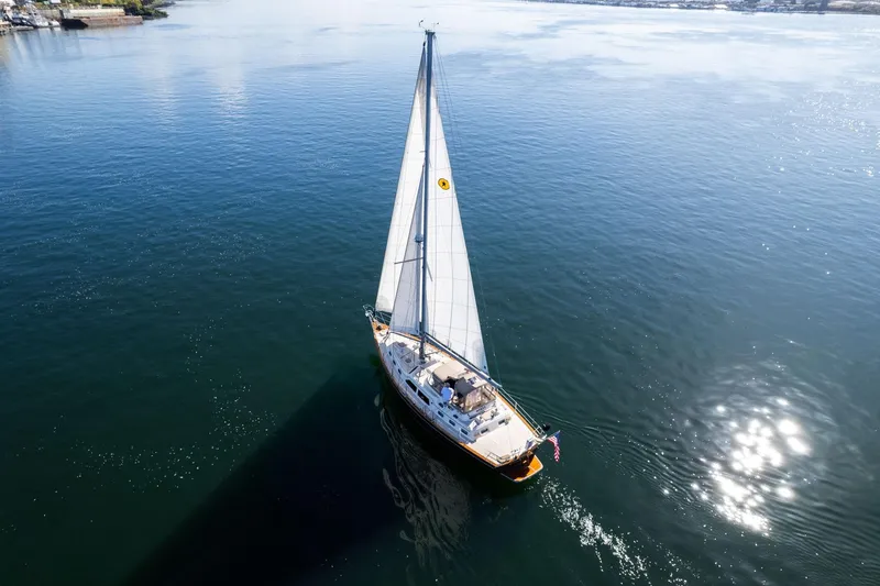 Slide: The Image of Sailing yacht Island Packet 465 (2008) gliding on calm waters under clear skies. - 79