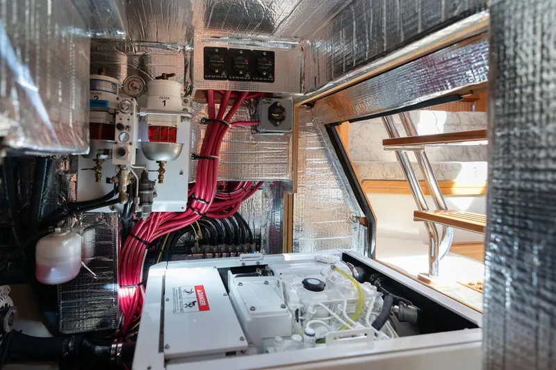 Slide: The Image of Engine room of 2008 Island Packet 465 yacht with insulation and wiring. - 83
