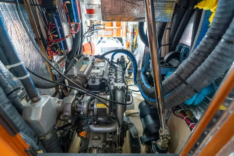 Slide: The Image of Engine room of 2008 Island Packet 465 sailboat, showcasing detailed mechanical components. - 85