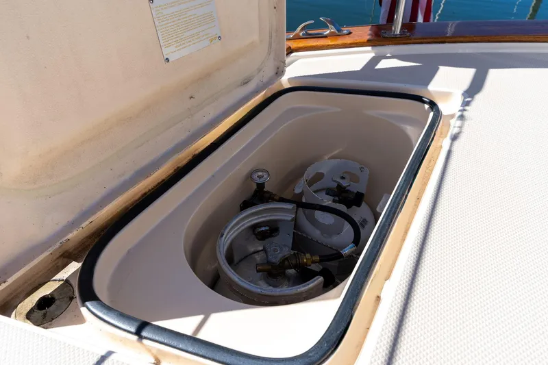 Slide: The Image of Storage compartment on 2008 Island Packet 465 yacht, containing propane tanks. - 87