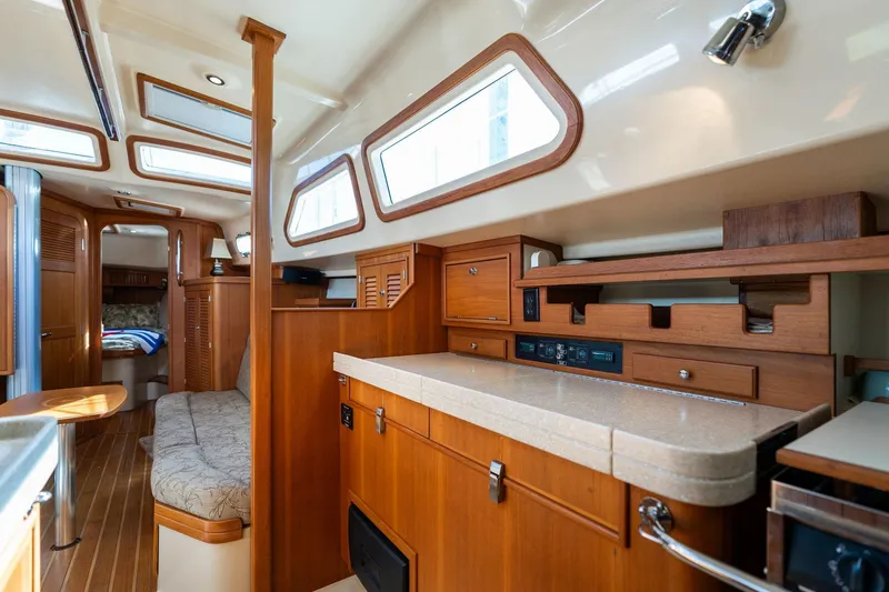 Slide: The Image of Luxurious 2008 Island Packet 465 yacht interior with wood finishes and ample natural light. - 9