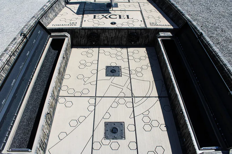Slide: The Image of Open storage compartment of Excel Tomahawk 183 boat, proudly made in Tennessee, 2026 model. - 12