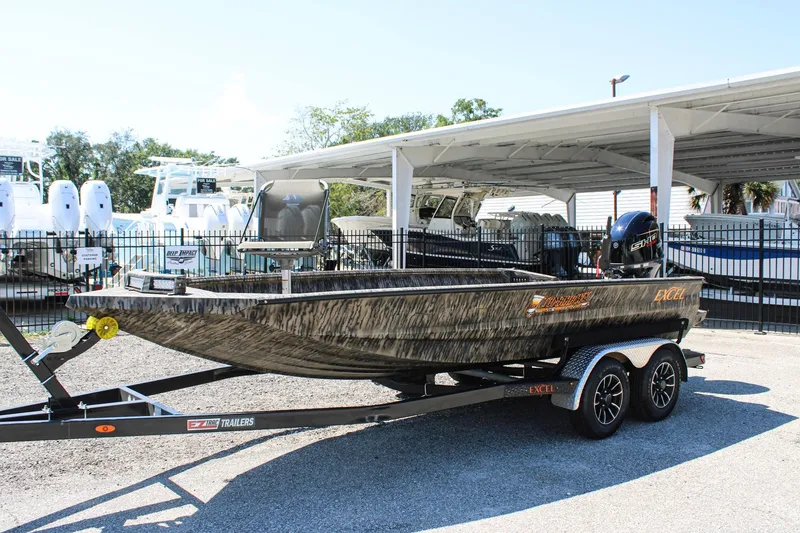 Slide: The Image of 2026 Excel Tomahawk 183 boat on trailer, parked outdoors at dealership. - 3