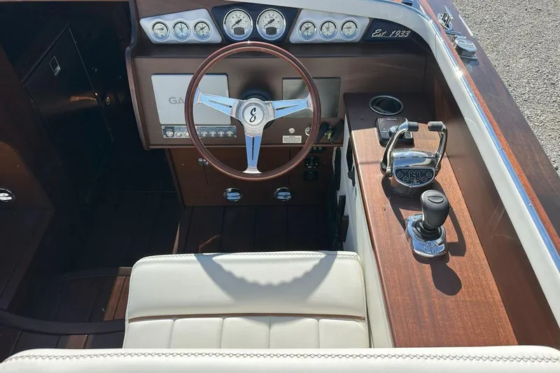 Slide: The Image of Interior of 2023 StanCraft 380 Rivelle boat with classic wooden dashboard and steering wheel. - 12