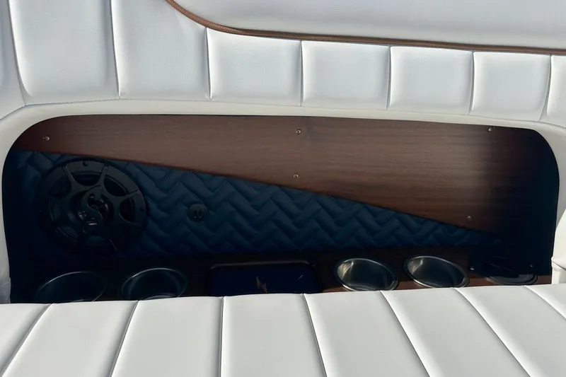 Slide: The Image of Luxurious interior of 2023 StanCraft 380 Rivelle with white leather seating and cup holders. - 23