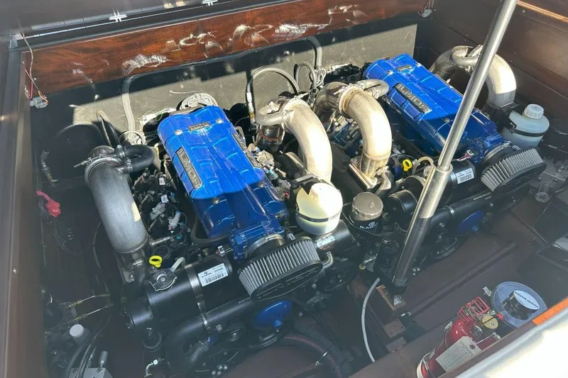 Slide: The Image of Engine compartment of 2023 StanCraft 380 Rivelle with dual blue engines and components. - 24