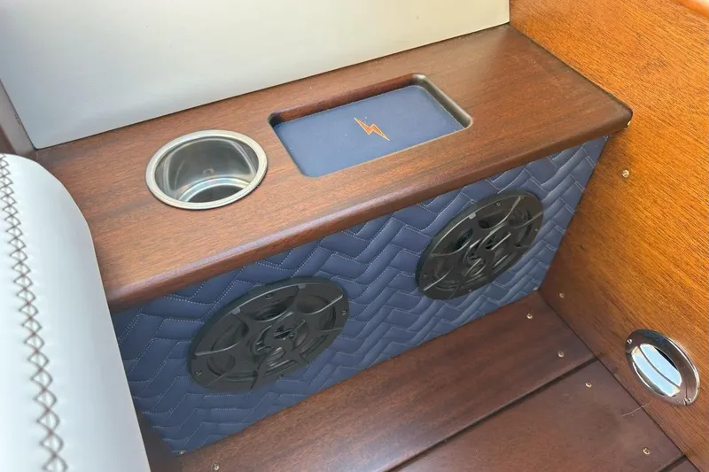 Slide: The Image of 2023 StanCraft 380 Rivelle interior detail with cup holder and speaker system. - 26