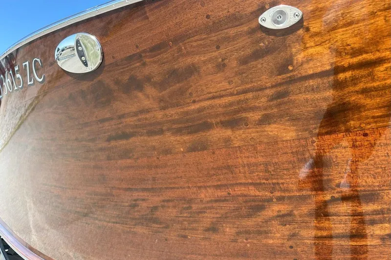 Slide: The Image of 2023 StanCraft 380 Rivelle boat with polished wooden finish and chrome details. - 4