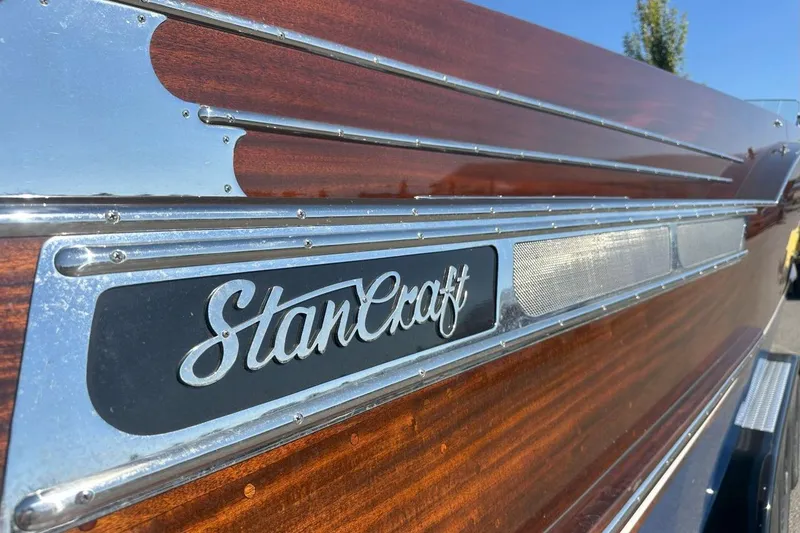 Slide: The Image of 2023 StanCraft 380 Rivelle boat with polished wood and metal detailing. - 7