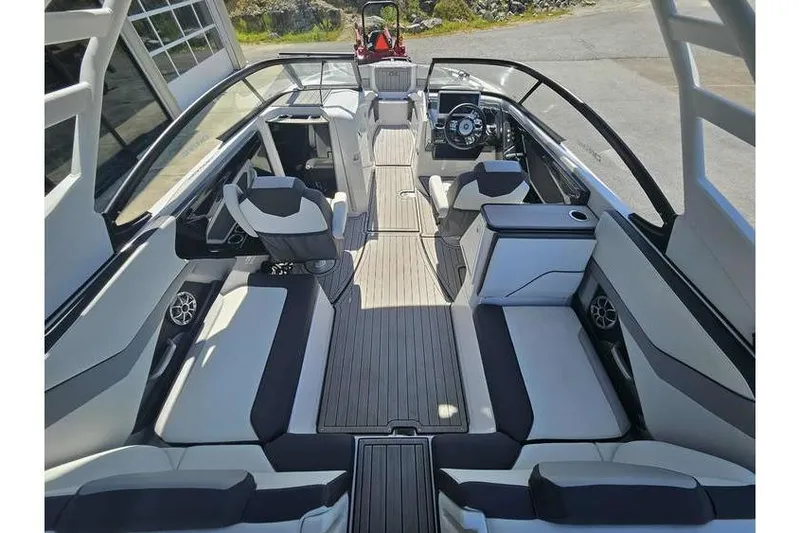 Slide: The Image of 2023 Yamaha Boats 252SD interior, featuring spacious seating and modern design. - 11
