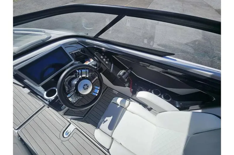 Slide: The Image of 2023 Yamaha Boats 252SD cockpit with modern steering and dashboard controls. - 2