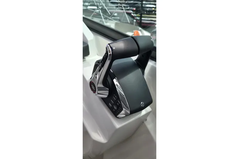 Slide: The Image of Close-up of 2025 Ventura Daycruicer throttle control in a modern boat cockpit. - 8