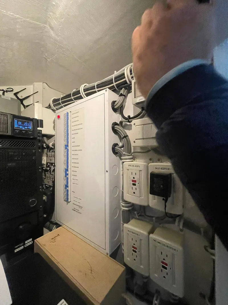Slide: The Image of Electrical panel and wiring inside a 2013 Hatteras GT63 yacht. - 27