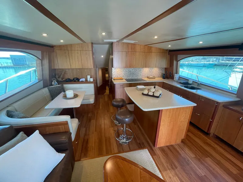 Slide: The Image of Luxurious interior of 2013 Hatteras GT63 yacht with modern kitchen and seating area. - 35