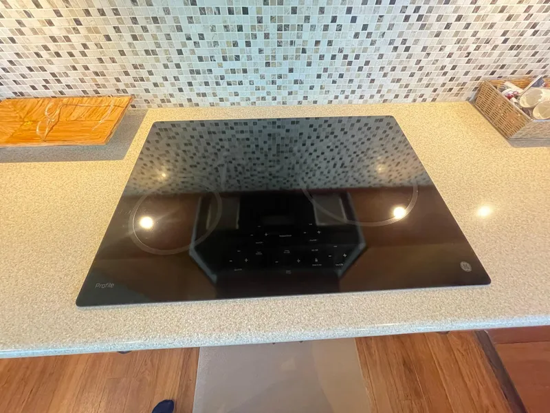 Slide: The Image of Modern kitchen cooktop on a Hatteras GT63 yacht, 2013 model. - 38
