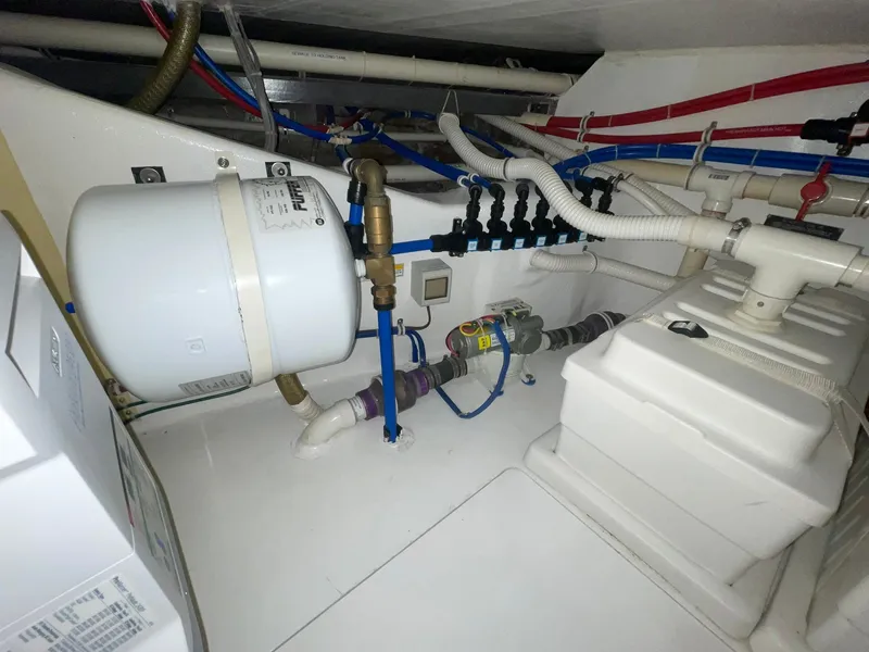 Slide: The Image of Engine room of 2013 Hatteras GT63 yacht with plumbing and equipment. - 8