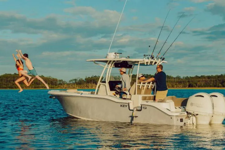 The Image of 2023 Key West 203 FS boat on trailer outside a storage facility. - 1