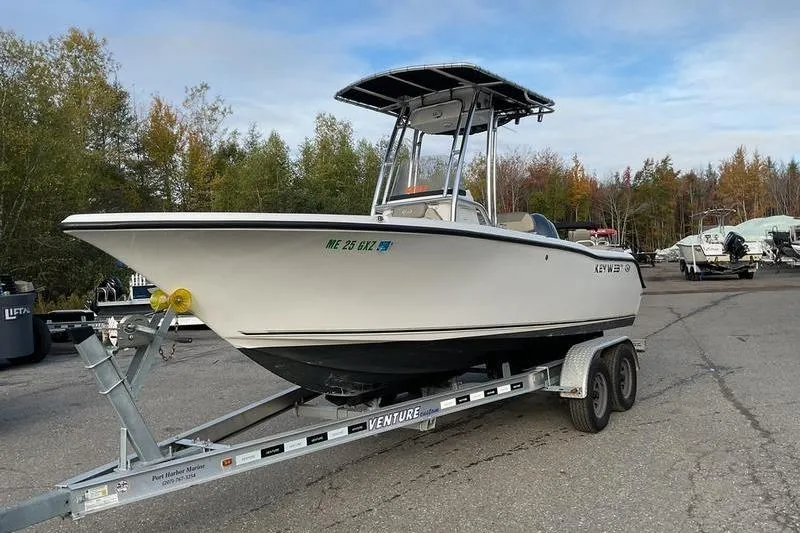 Slide: The Image of 2023 Key West 203 FS boat on trailer in outdoor setting. - 7