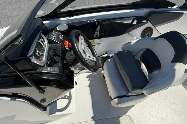 Slide: The Image of Interior of 2020 Scarab 195 ID boat with steering wheel and seating. - 12