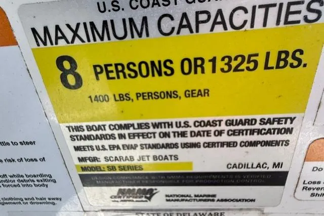 Slide: The Image of Scarab 195 ID 2020 boat capacity label: 8 persons or 1325 lbs, U.S. Coast Guard compliant. - 13