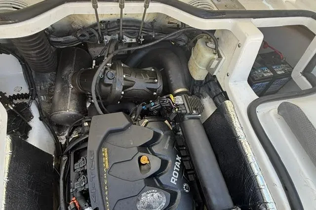 Slide: The Image of Engine compartment of a 2020 Scarab 195 ID boat, featuring a Rotax engine. - 15