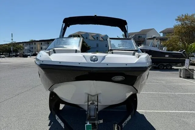 Slide: The Image of 2020 Scarab 195 ID boat in a parking lot, front view, sunny day. - 3