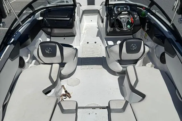 Slide: The Image of 2020 Scarab 195 ID boat interior with modern seating and steering wheel. - 8