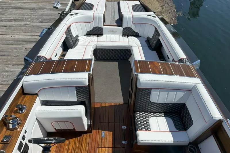 Slide: The Image of Luxurious 2020 StanCraft 290 Rivelle boat interior with elegant seating and wood accents. - 10
