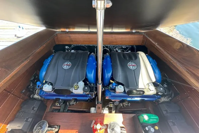 Slide: The Image of Twin engines in a 2020 StanCraft 290 Rivelle boat, showcasing powerful marine engineering. - 13