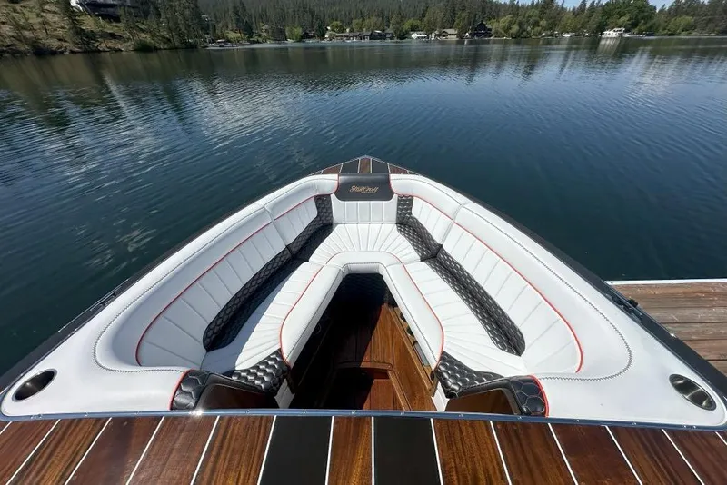 Slide: The Image of Luxurious 2020 StanCraft 290 Rivelle boat interior with elegant seating on a serene lake. - 7