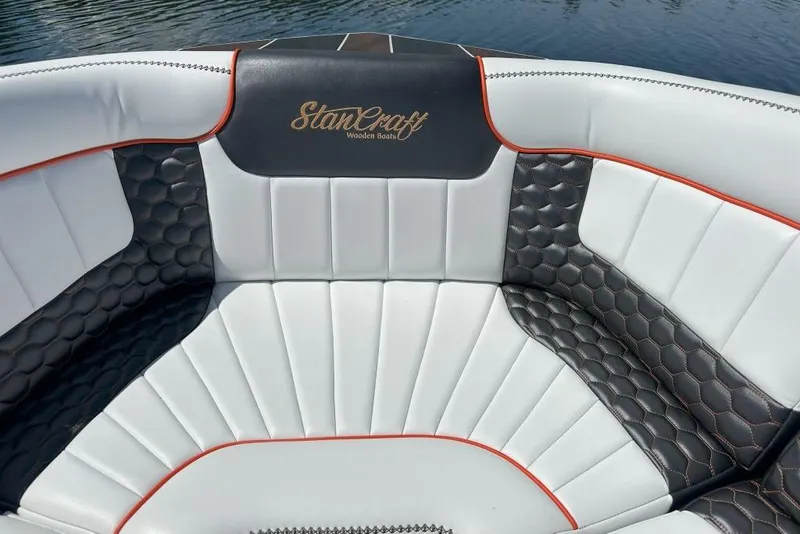 Slide: The Image of 2020 StanCraft 290 Rivelle boat interior with elegant white and black leather seating. - 8