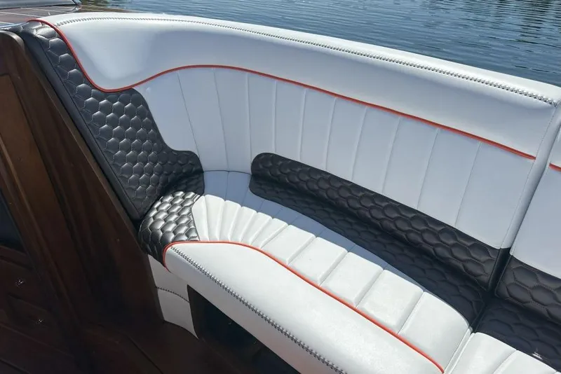 Slide: The Image of Luxury seating on 2020 StanCraft 290 Rivelle boat with elegant white and black upholstery. - 9