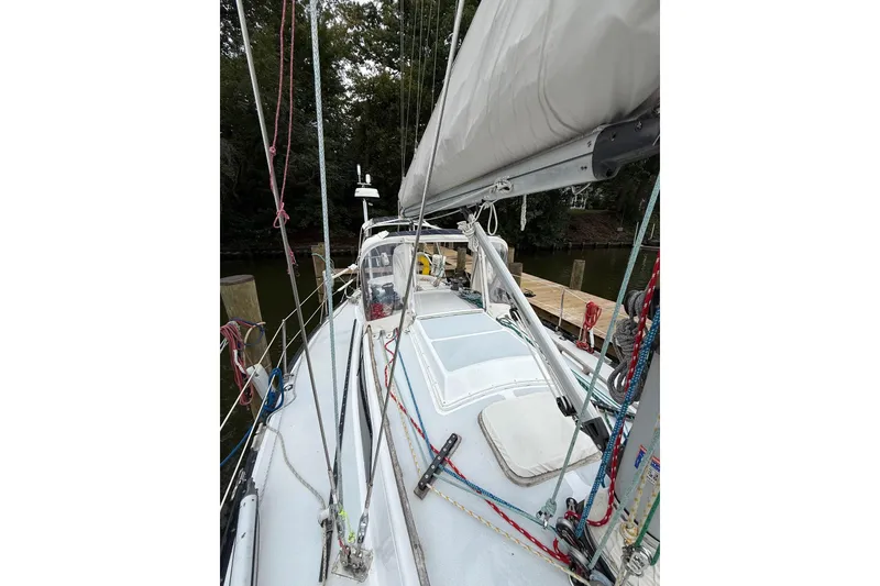 Slide: The Image of 1988 Sparkman & Stephens 36 sailboat deck with rigging and docked at marina. - 14